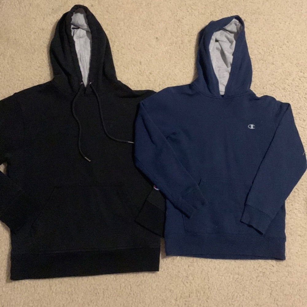 Two champion hoodies black one is men’s S the navy is boys M.